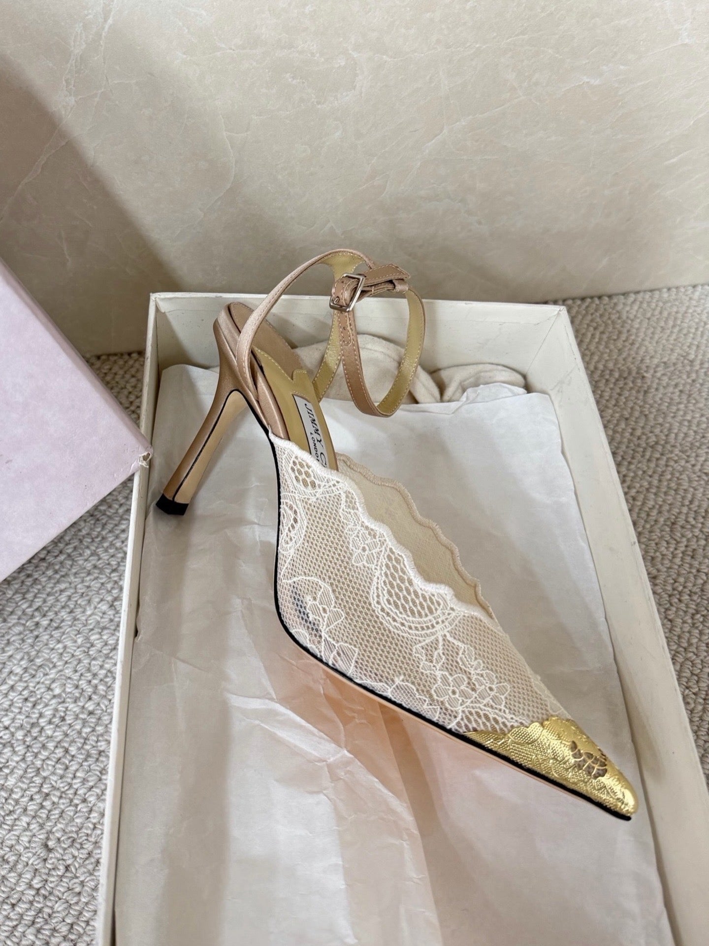 Jimmy Choo lace floral appliqué pumps.