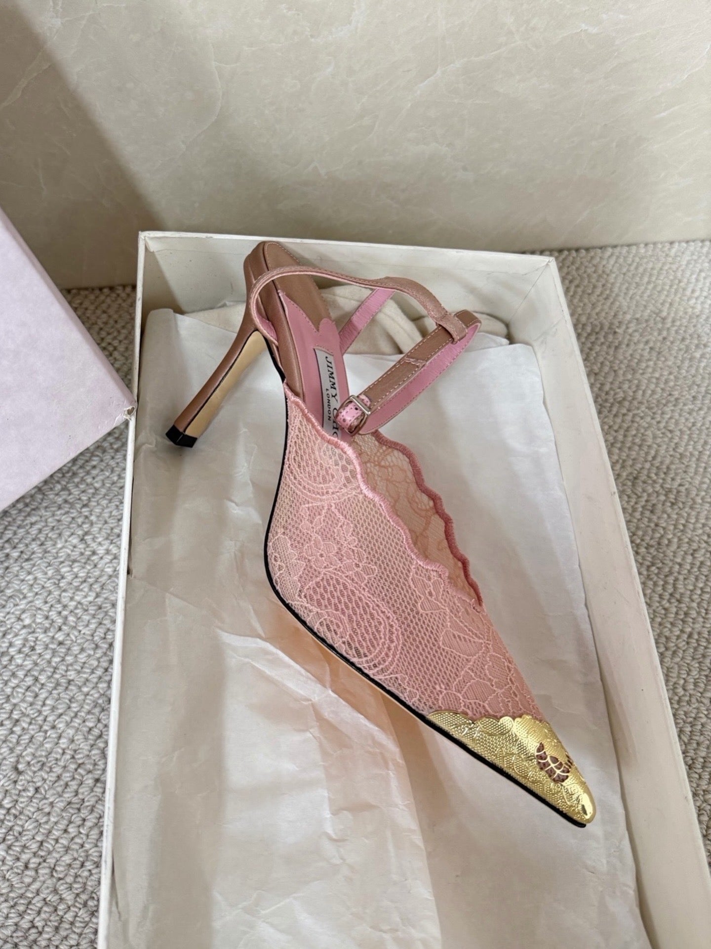 Jimmy Choo lace floral appliqué pumps.