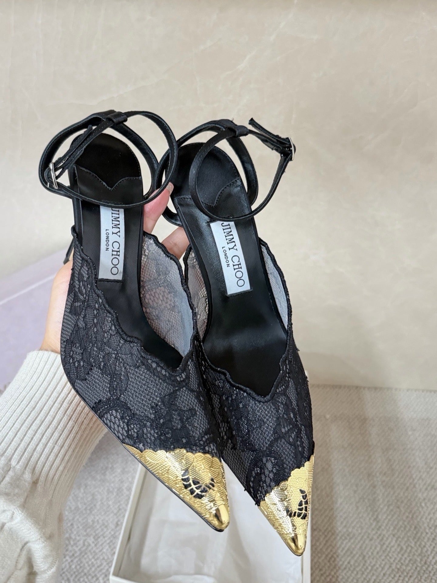 Jimmy Choo lace floral appliqué pumps.