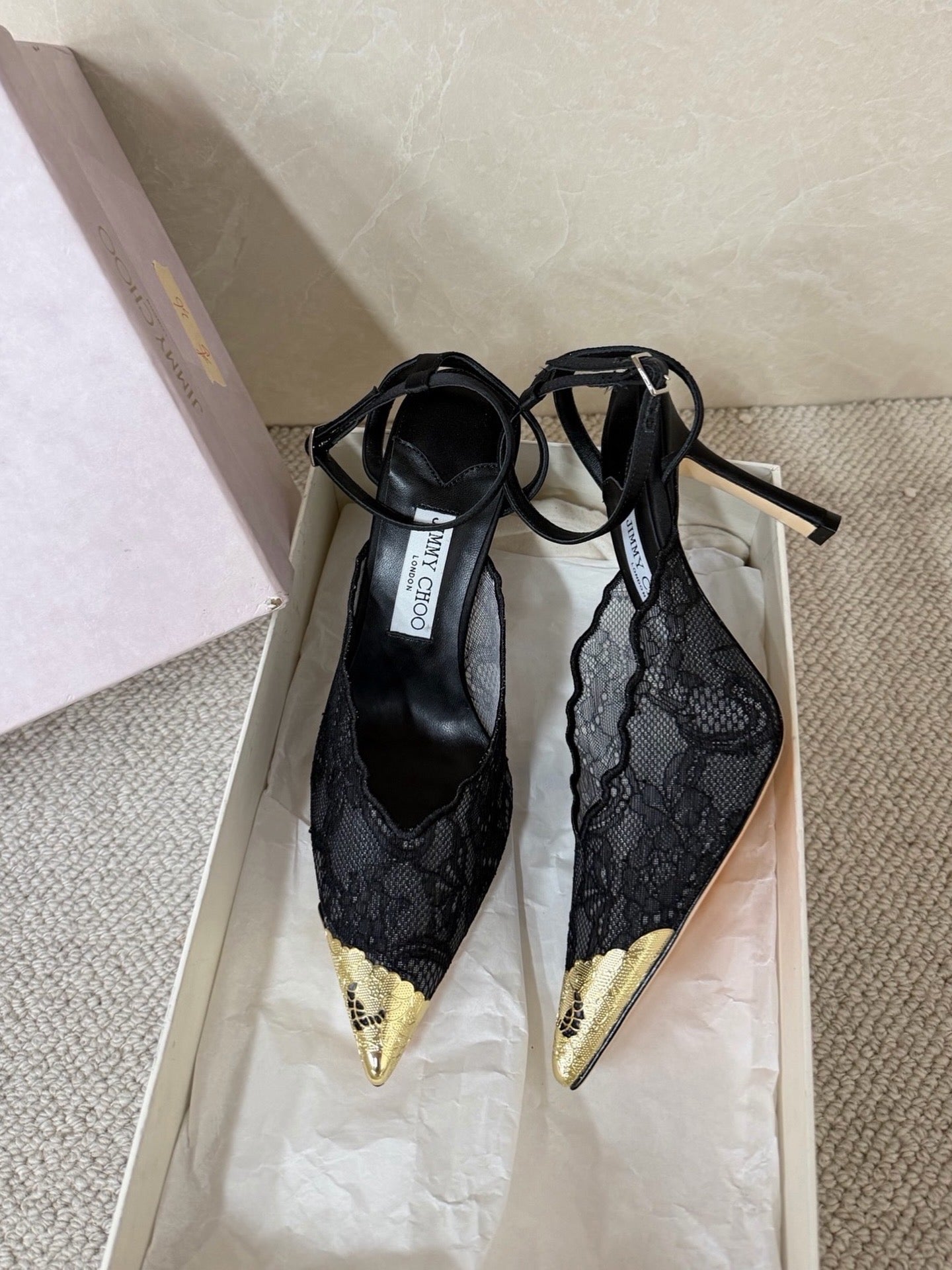 Jimmy Choo lace floral appliqué pumps.