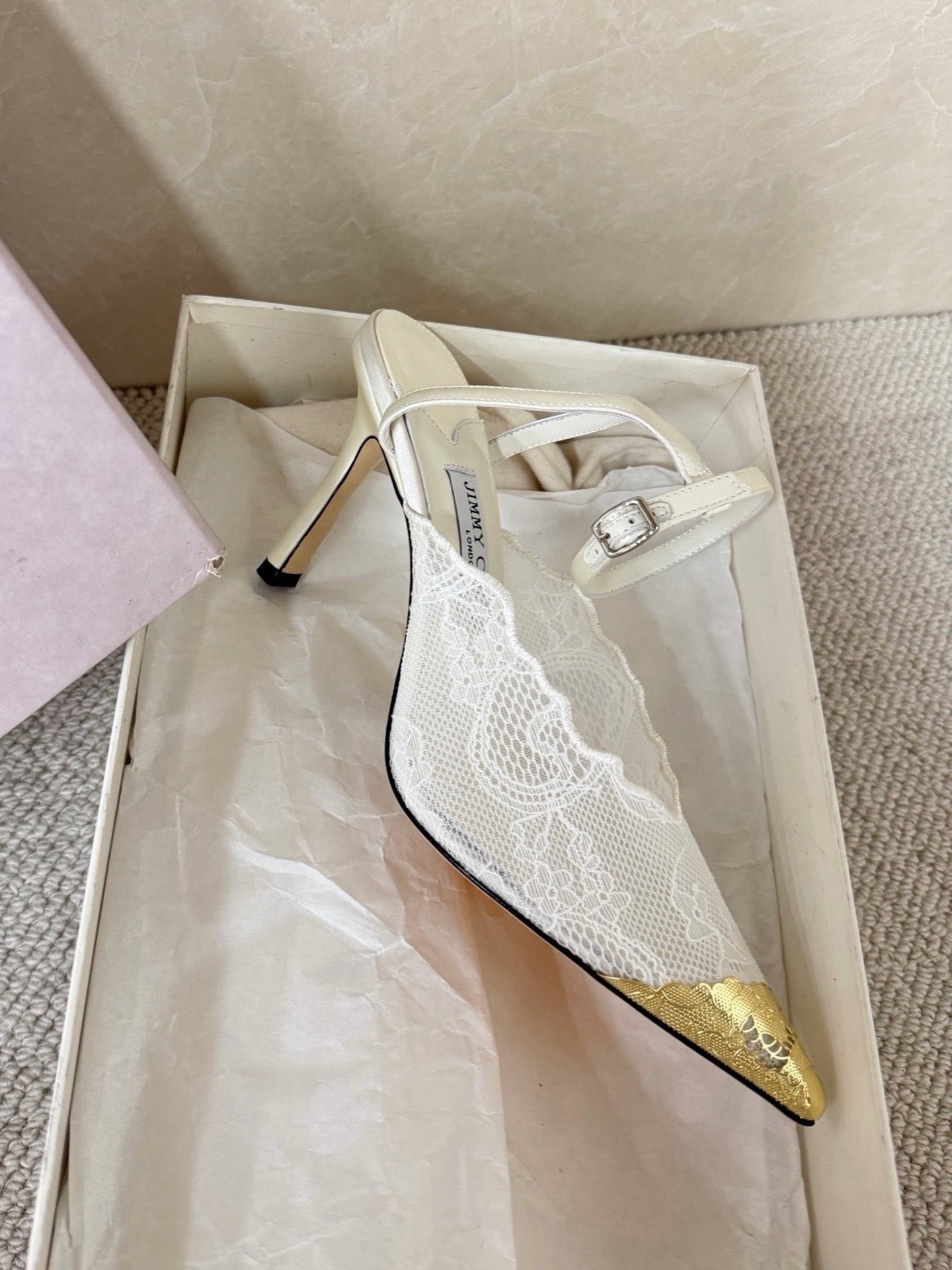 Jimmy Choo lace floral appliqué pumps.