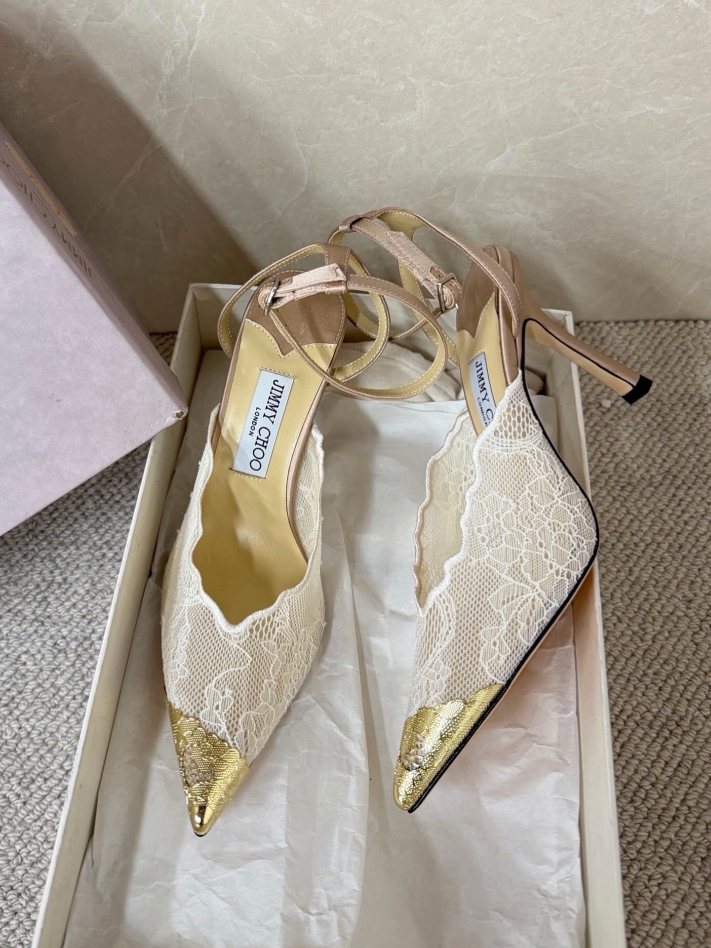 Jimmy Choo lace floral appliqué pumps.