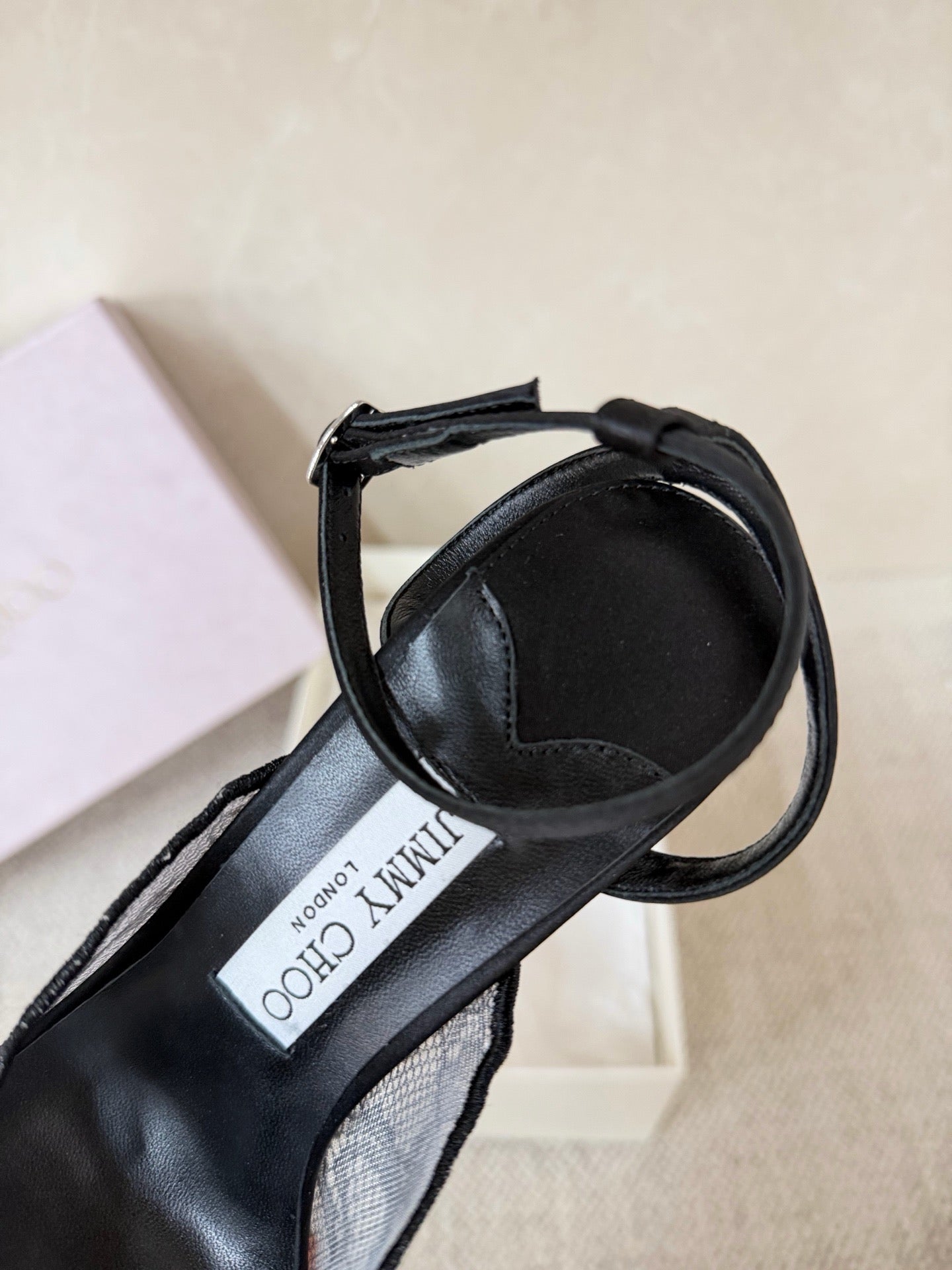 Jimmy Choo lace floral appliqué pumps.