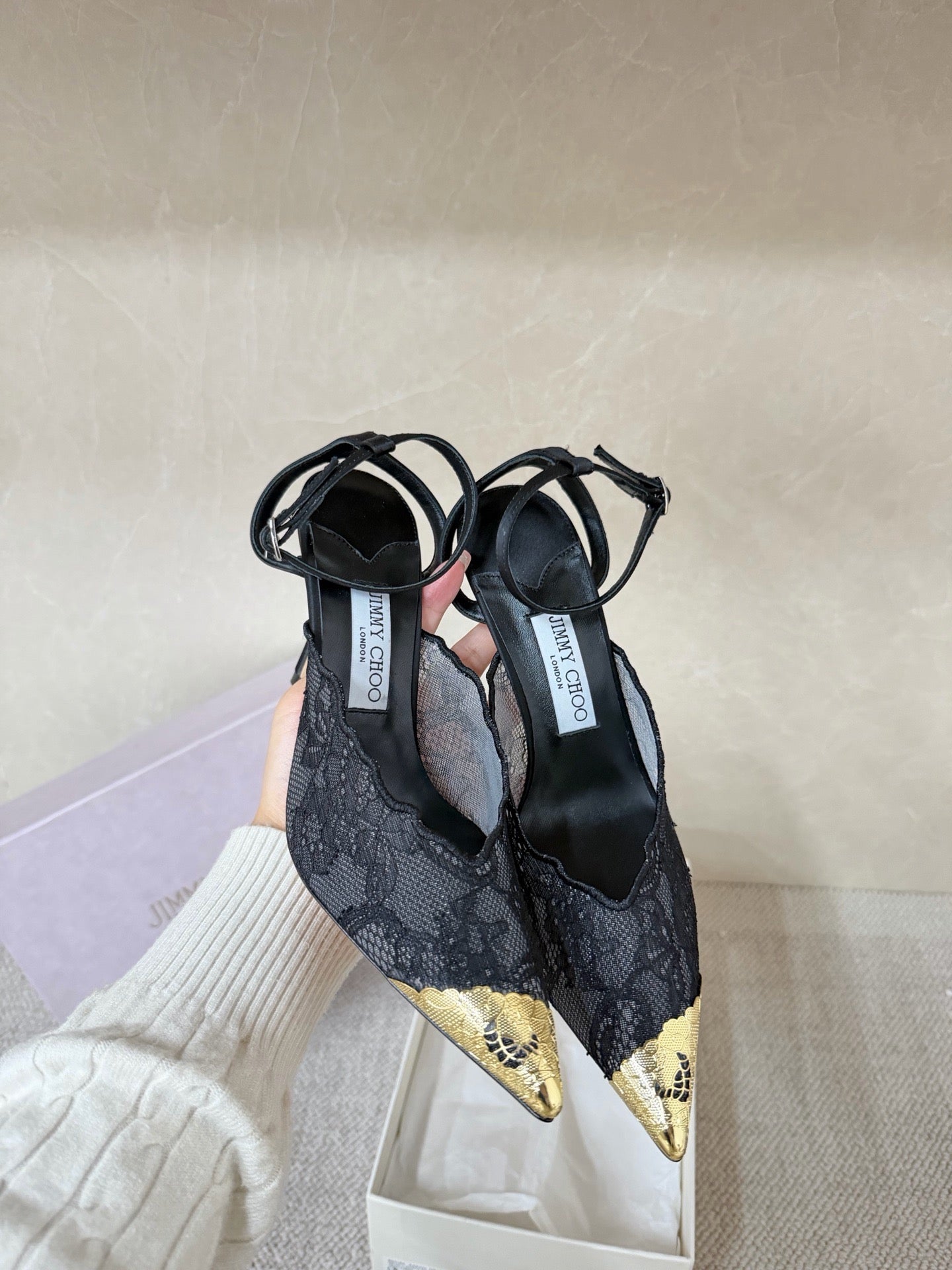 Jimmy Choo lace floral appliqué pumps.